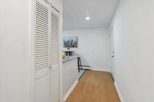 a view of a hallway with workspace