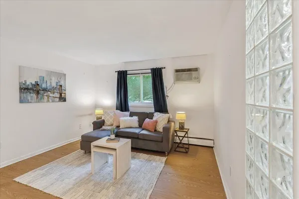 a living room with furniture and a rug