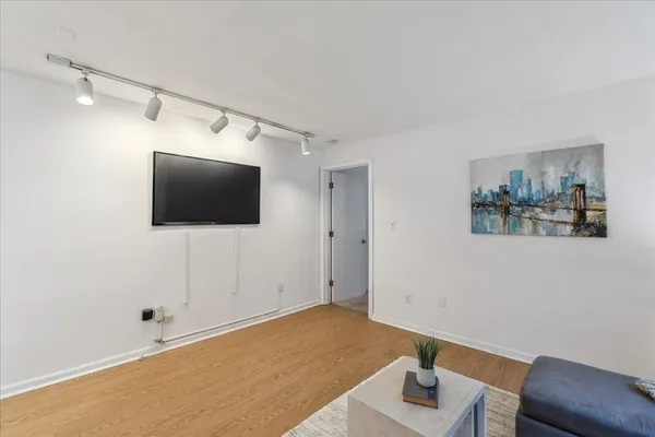 a living room with a flat screen tv