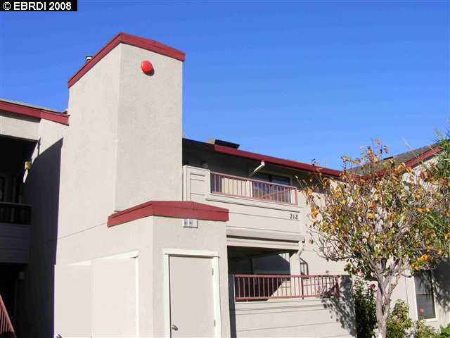 8 Lancaster Circle, Unit 218 Bay Point, CA 94565 - Photo 1 of 1 a front view of a house with plants