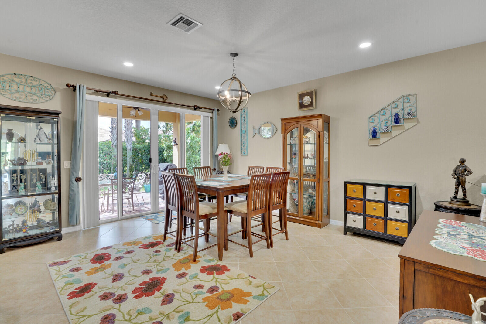 212 Behring Way Jupiter, FL 33458 - Photo 13 of 56 a view of a dining room with furniture window and outside view