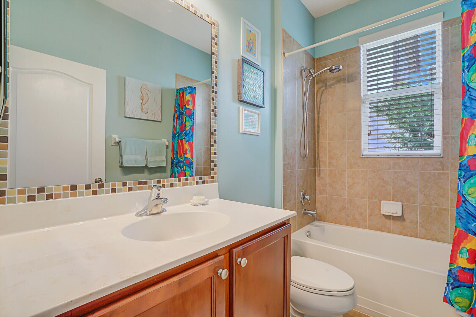 212 Behring Way Jupiter, FL 33458 - Photo 22 of 56 a bathroom with a sink a toilet a tub and shower