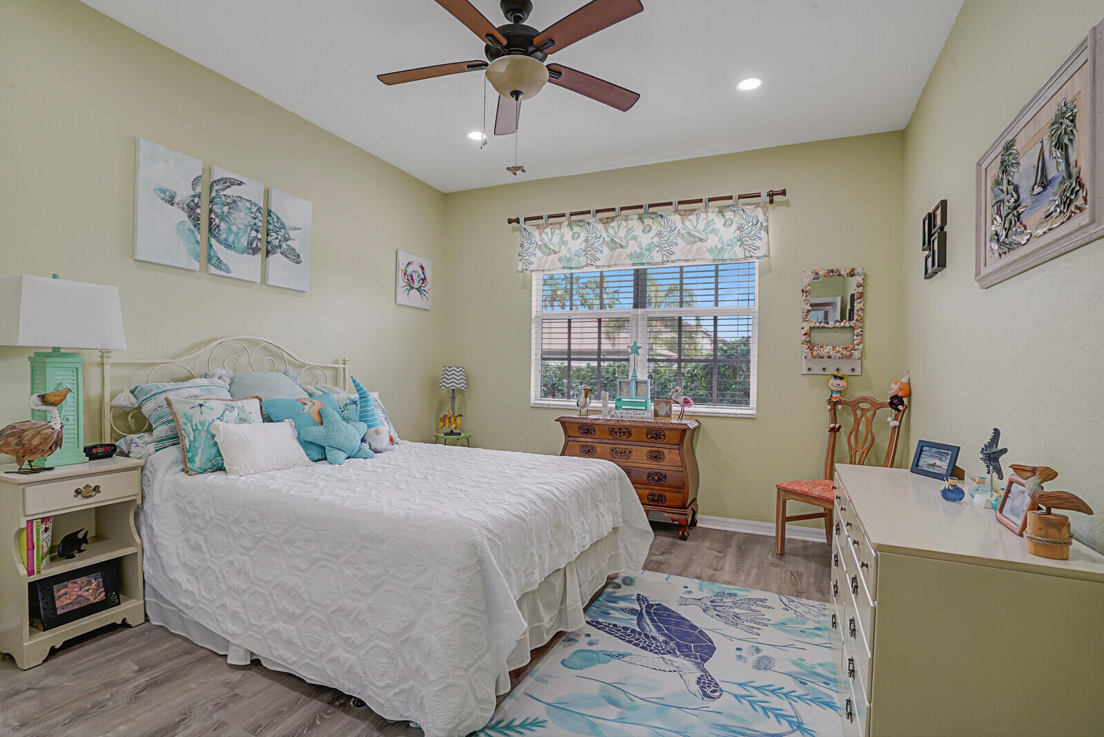 212 Behring Way Jupiter, FL 33458 - Photo 23 of 56 a bedroom with a bed wooden floor and window