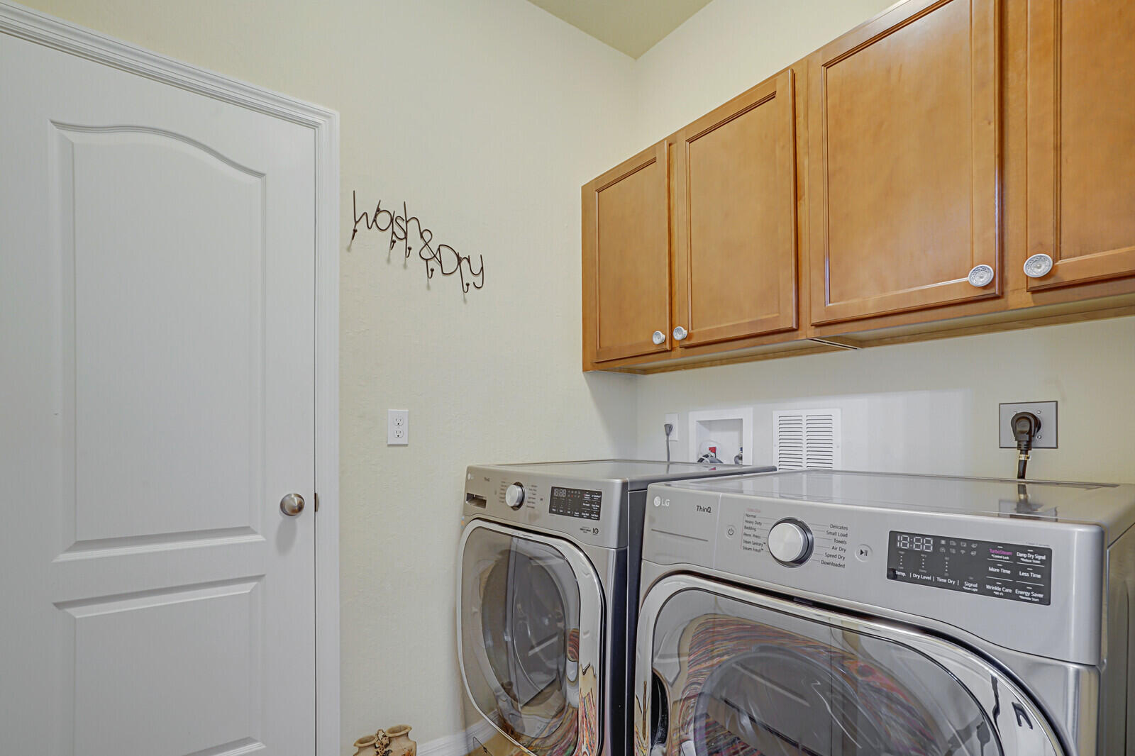 212 Behring Way Jupiter, FL 33458 - Photo 24 of 56 a utility room with dryer and washer