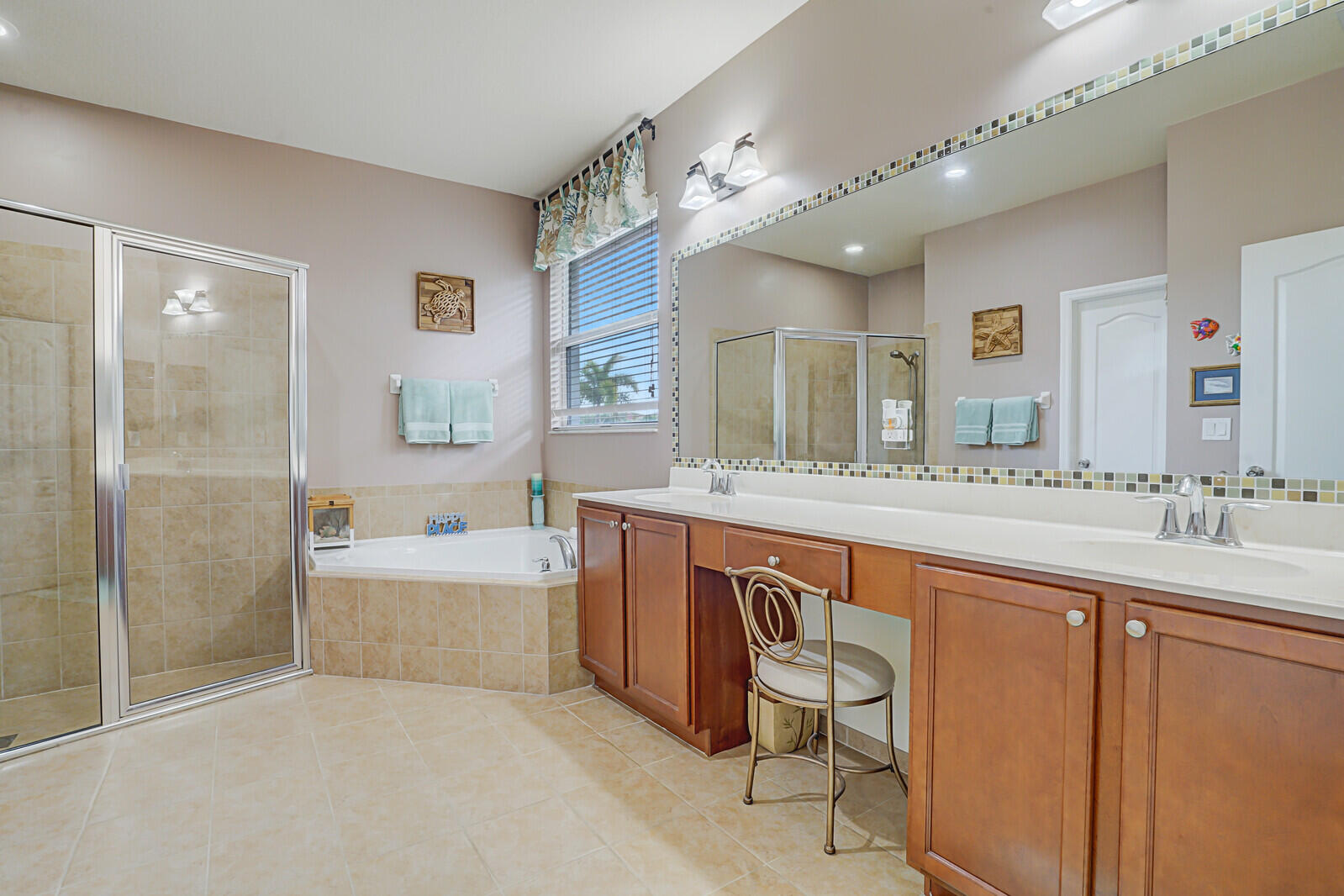212 Behring Way Jupiter, FL 33458 - Photo 29 of 56 a spacious bathroom with a double vanity sink mirror and bathtub