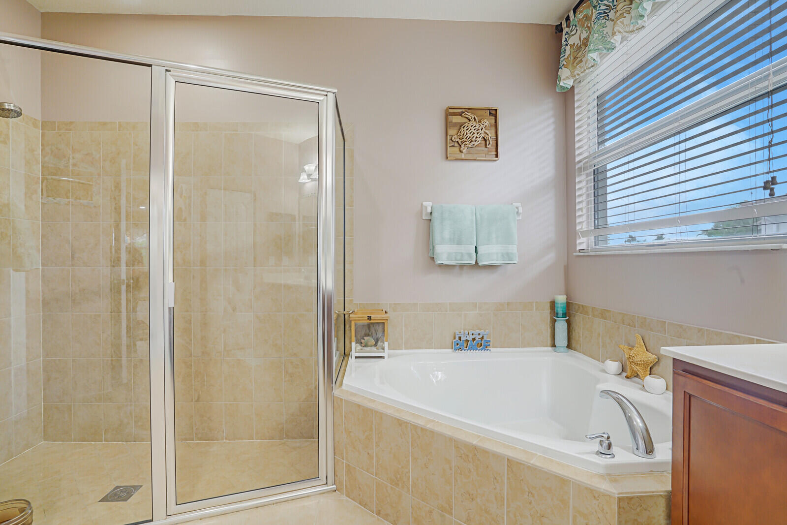 212 Behring Way Jupiter, FL 33458 - Photo 30 of 56 a white bath tub sitting next to a white sink