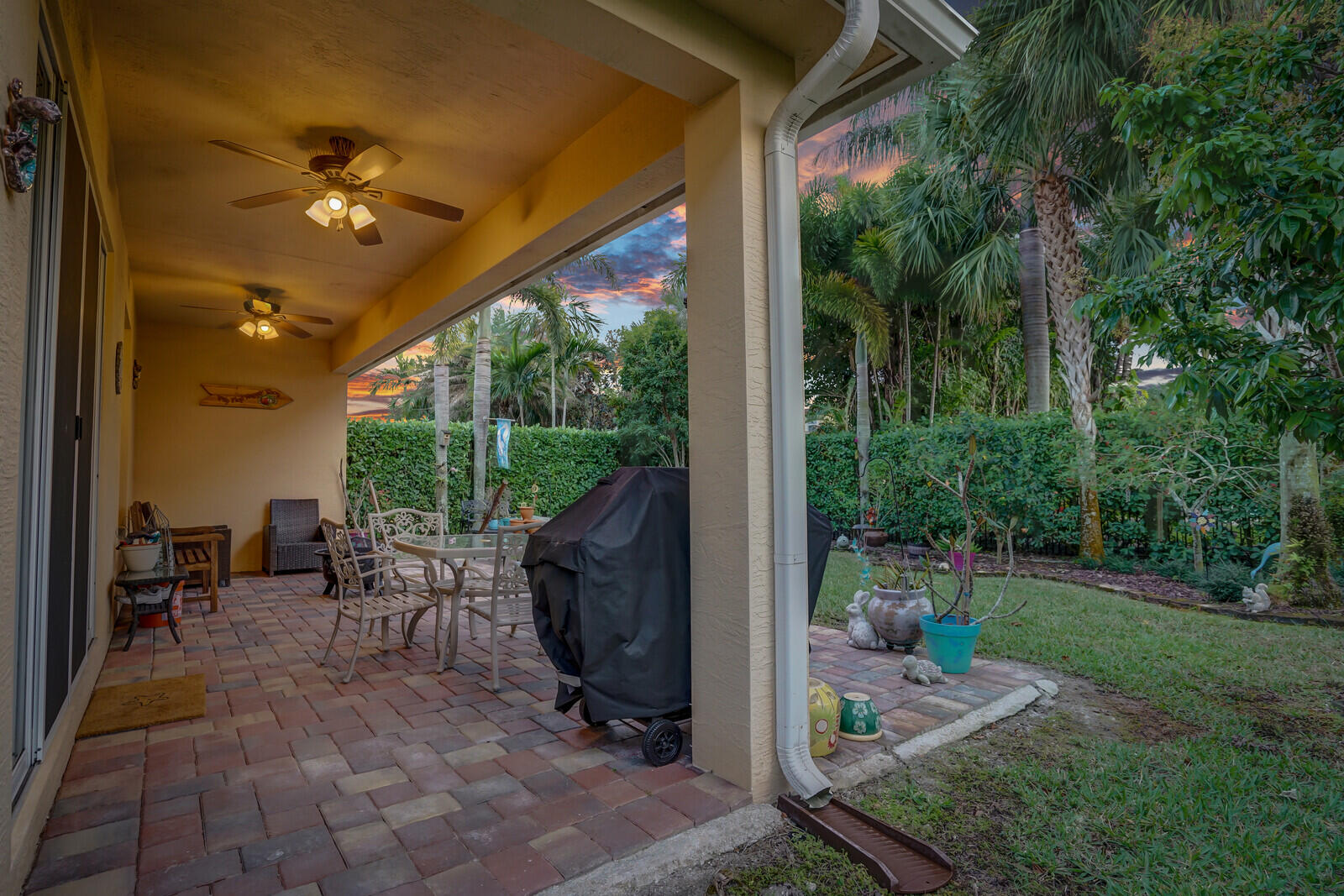 212 Behring Way Jupiter, FL 33458 - Photo 34 of 56 a view of a porch with chairs and backyard