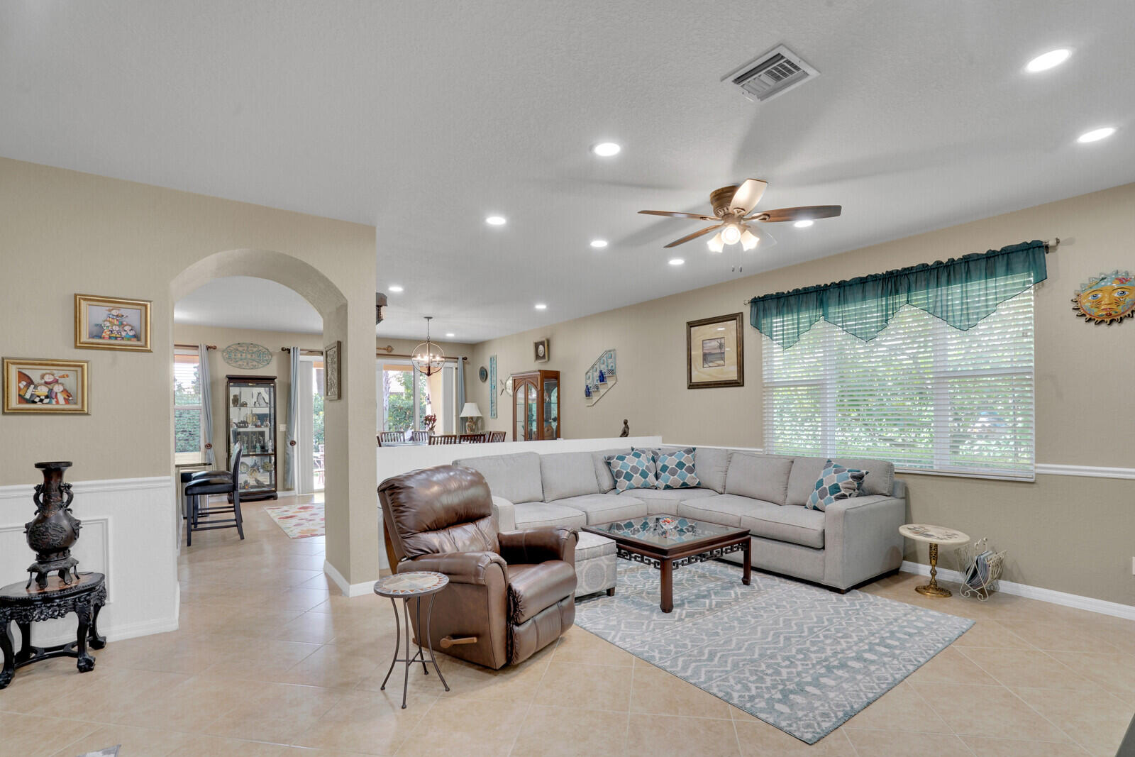212 Behring Way Jupiter, FL 33458 - Photo 5 of 56 a living room with furniture and a large window