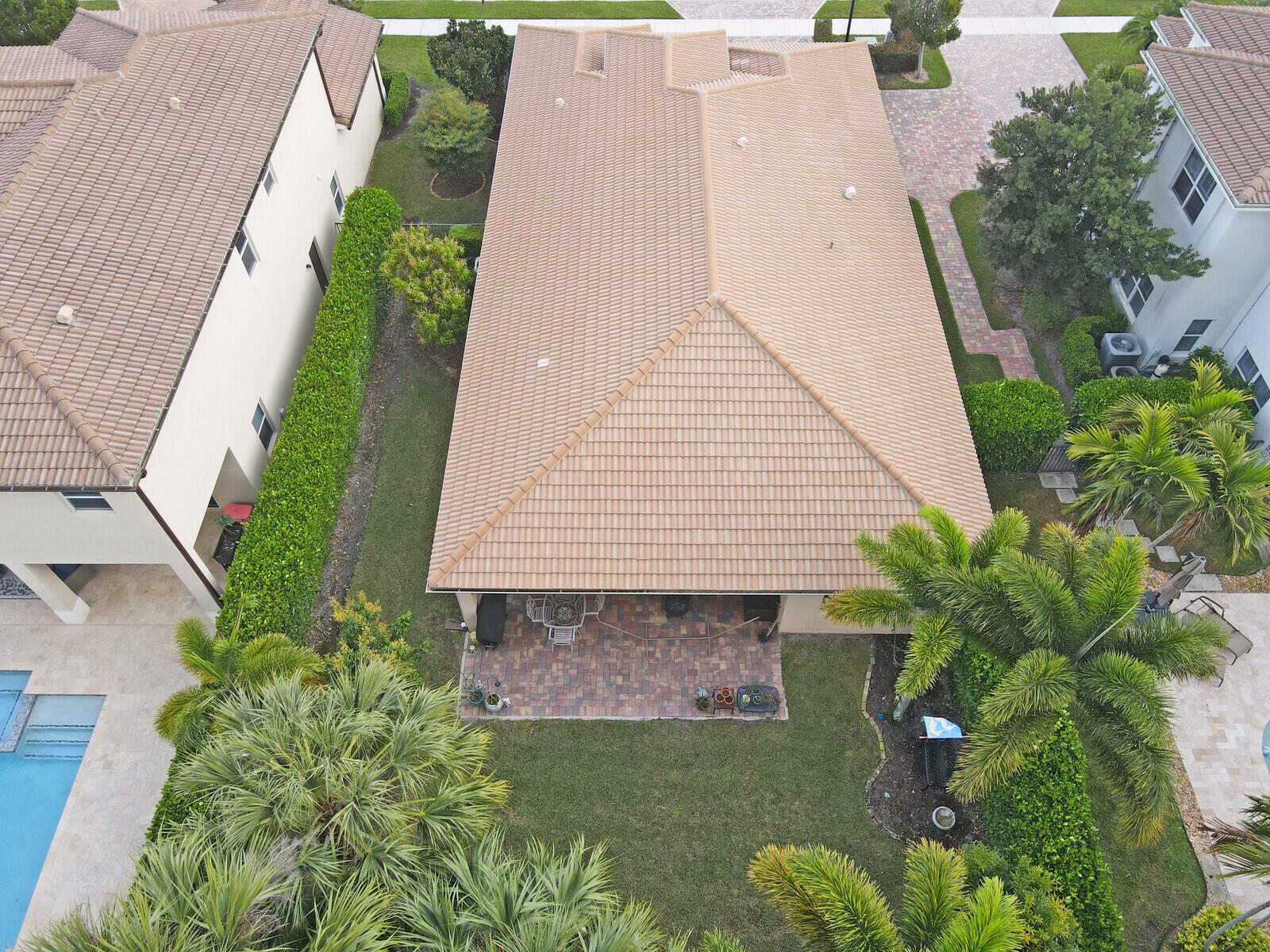212 Behring Way Jupiter, FL 33458 - Photo 53 of 56 an aerial view of a house with a yard and potted plants