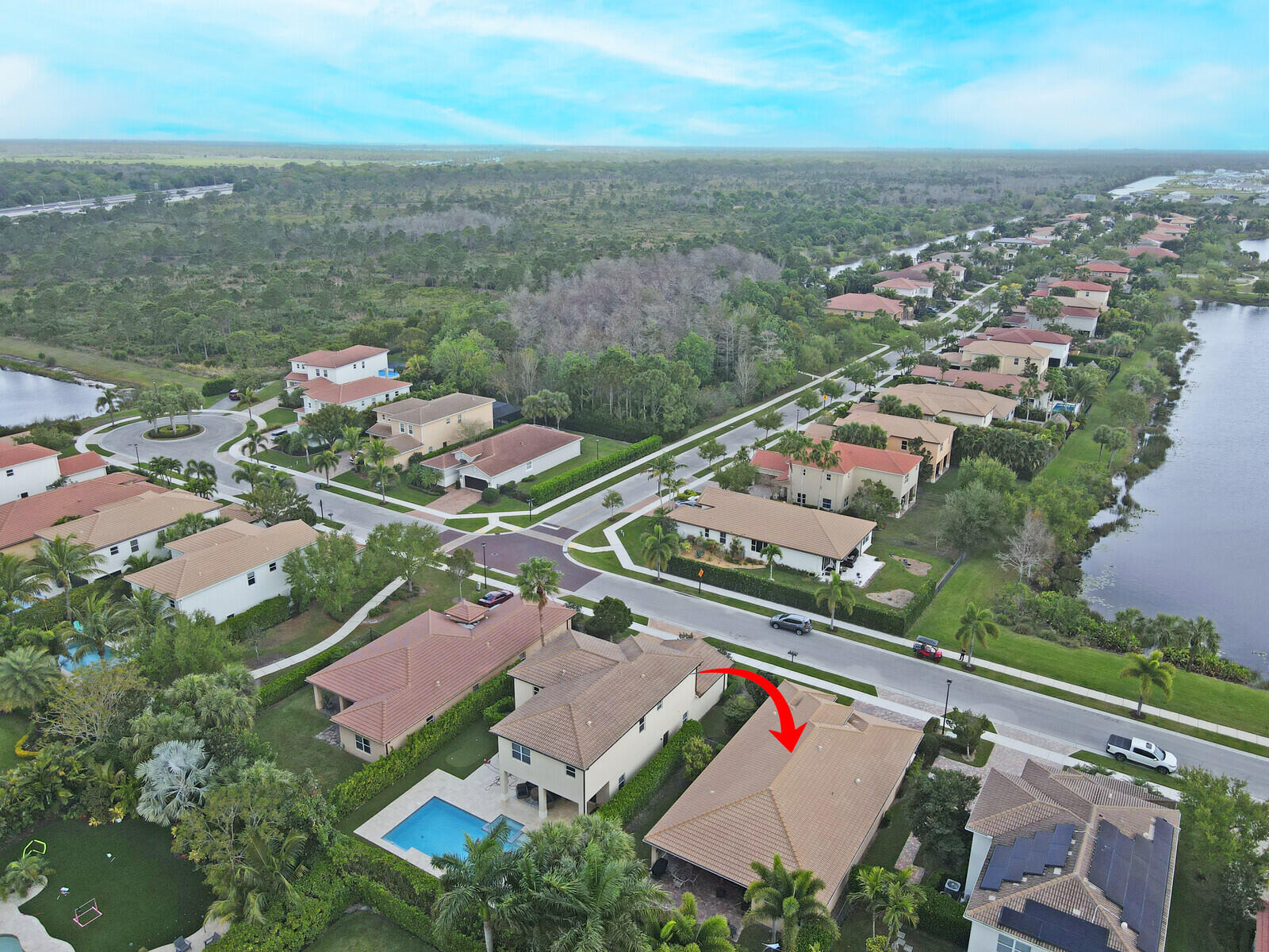 212 Behring Way Jupiter, FL 33458 - Photo 54 of 56 an aerial view of residential houses with outdoor space