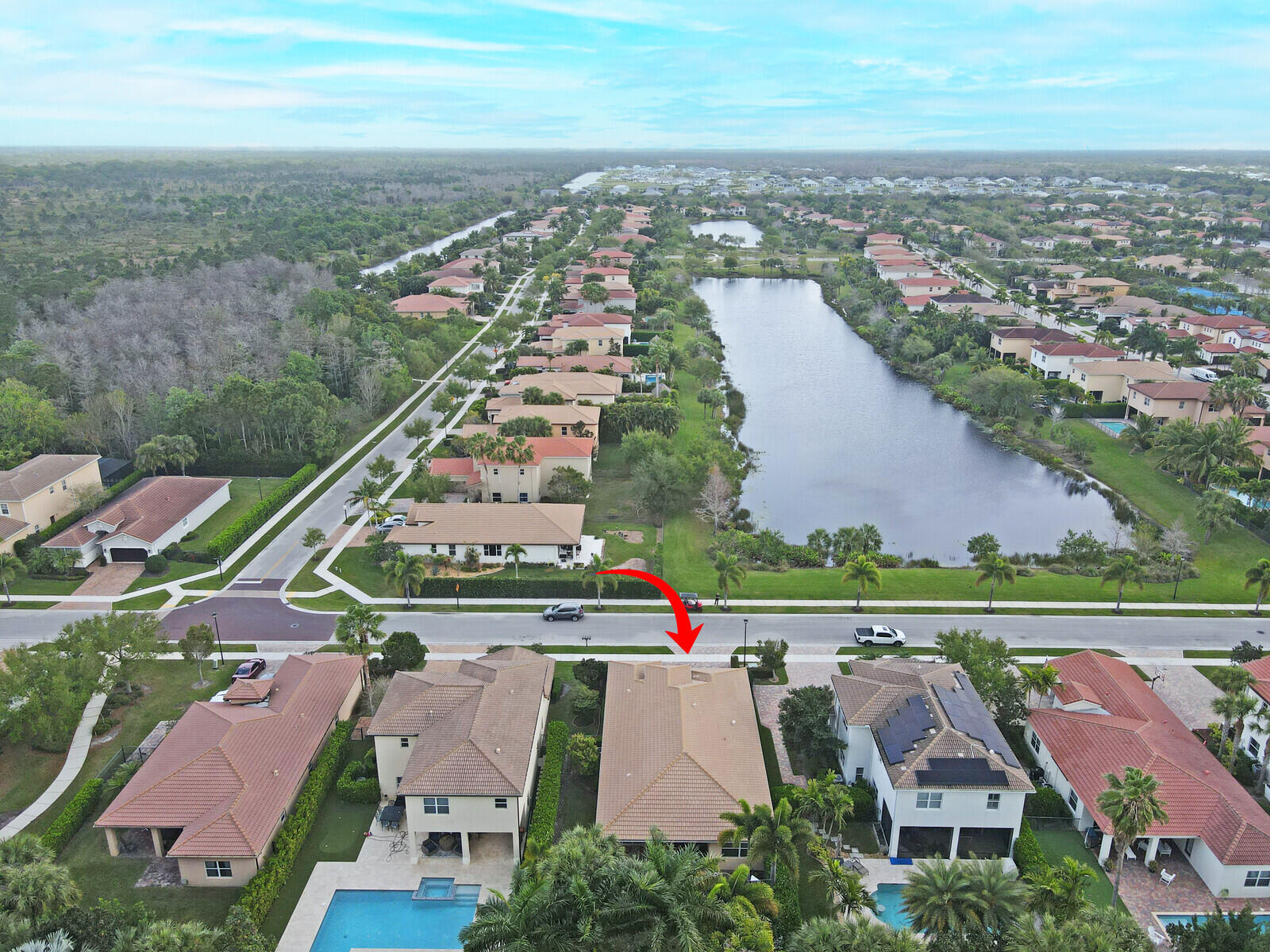 212 Behring Way Jupiter, FL 33458 - Photo 55 of 56 an aerial view of residential houses with outdoor space