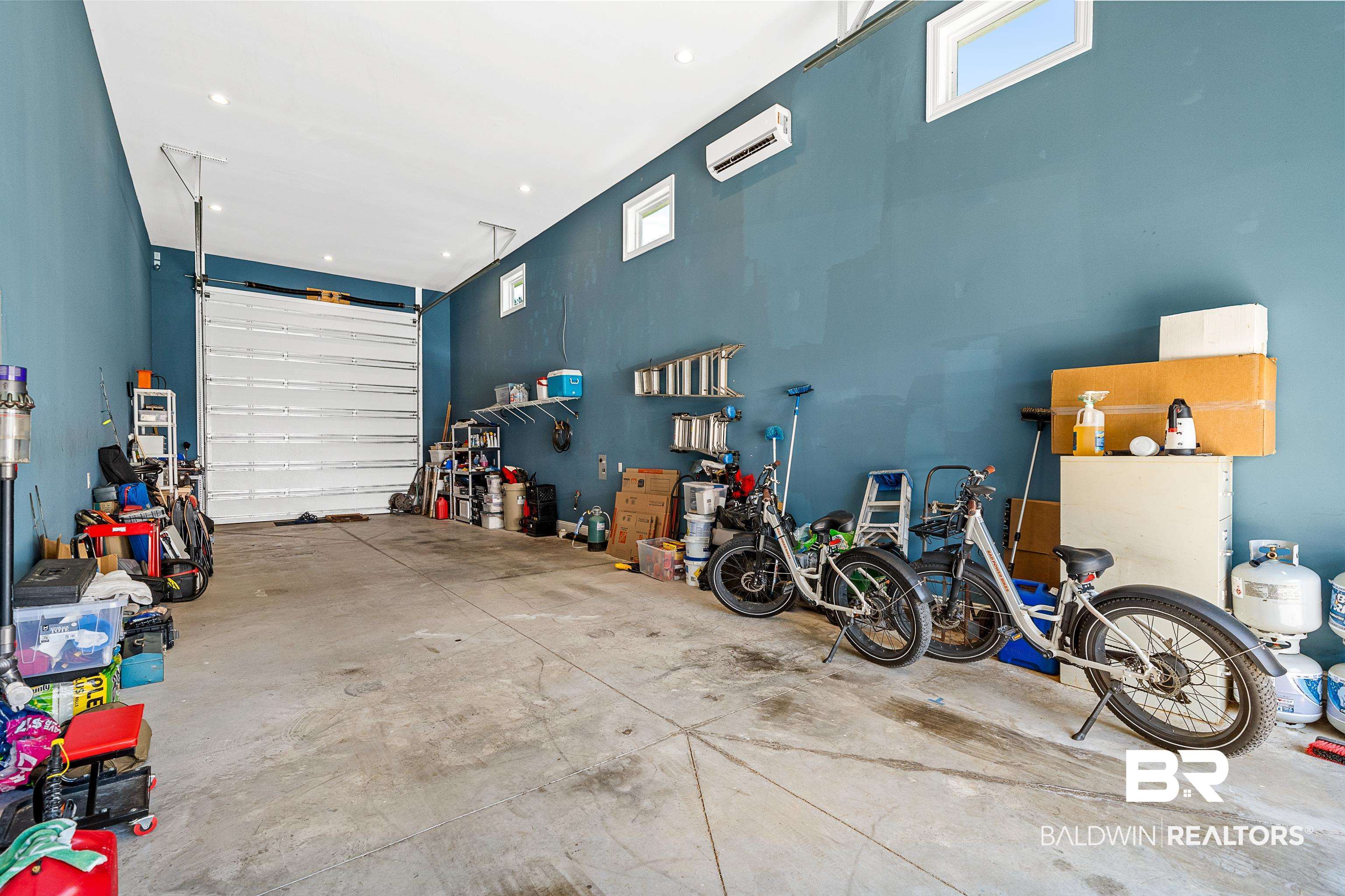 12329 Reunion Place, Unit LOT 38 Foley, AL 36535 - Photo 20 of 43 Garage featuring recessed lighting and an AC wall unit