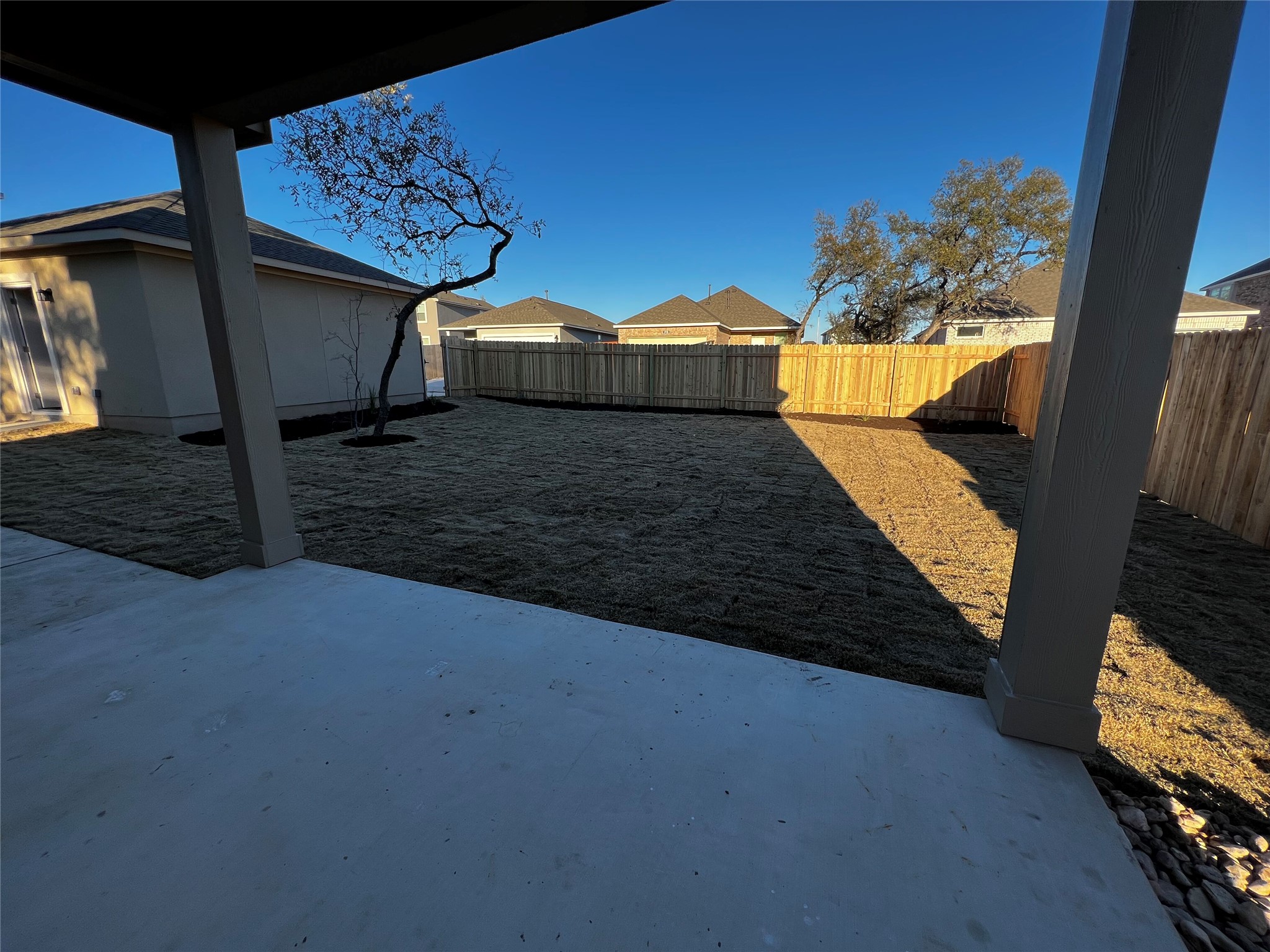 2720 Juniper Woods Road Leander, TX 78641 - Photo 6 of 8 The property features an extensive backyard with a newly installed privacy fence and a newly seeded lawn