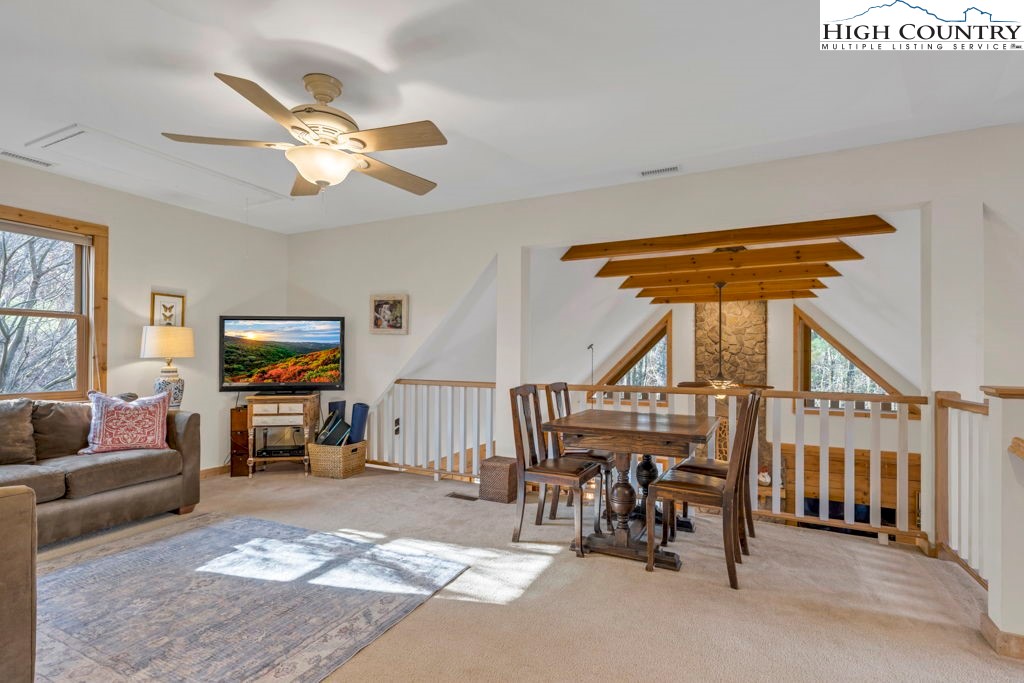 672 Kalmia Lane Boone, NC 28607 - Photo 24 of 41 a living room with furniture and a flat screen tv