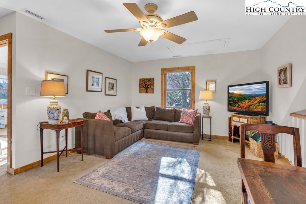 672 Kalmia Lane Boone, NC 28607 - Photo 25 of 41 a living room with furniture and a flat screen tv