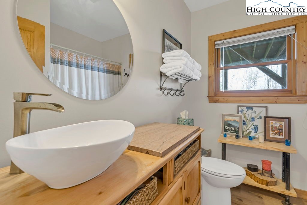 672 Kalmia Lane Boone, NC 28607 - Photo 31 of 41 a bathroom with a sink and a mirror