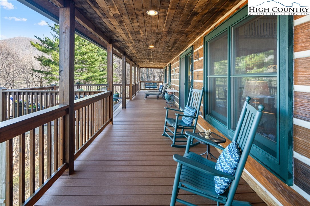 672 Kalmia Lane Boone, NC 28607 - Photo 5 of 41 a view of a porch with furniture and wooden floor