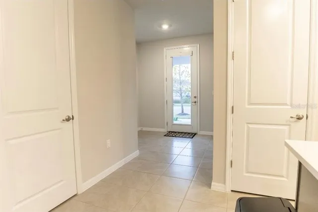 a view of a room with gym equipment and a large window