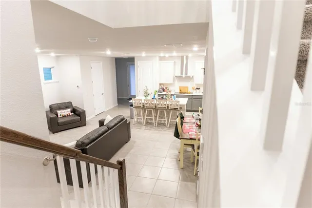 a view of staircase with white walls