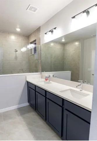 a white toilet sitting next to a shower