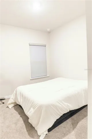 a bedroom with a bed and a cabinets