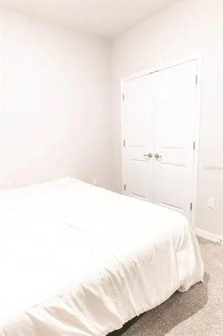 an empty room with toys and plants