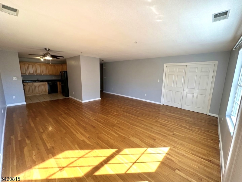 111 Harris Avenue, Unit 5 Middlesex, NJ 08846 - Photo 2 of 6 a view of empty room with wooden floor