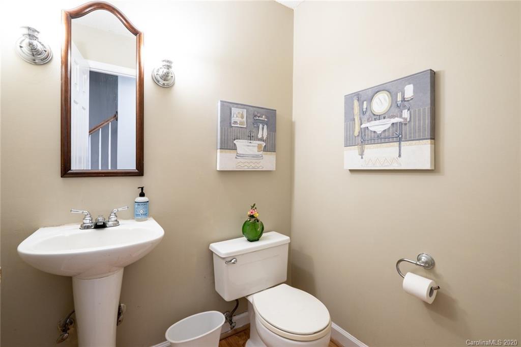 1130 Churchill Road Davidson, NC 28036 - Photo 16 of 38 a bathroom with a toilet a sink and mirror