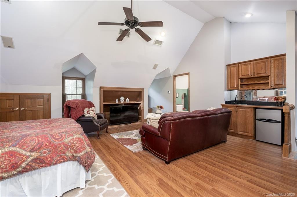 1130 Churchill Road Davidson, NC 28036 - Photo 18 of 38 a living room with furniture and a flat screen tv