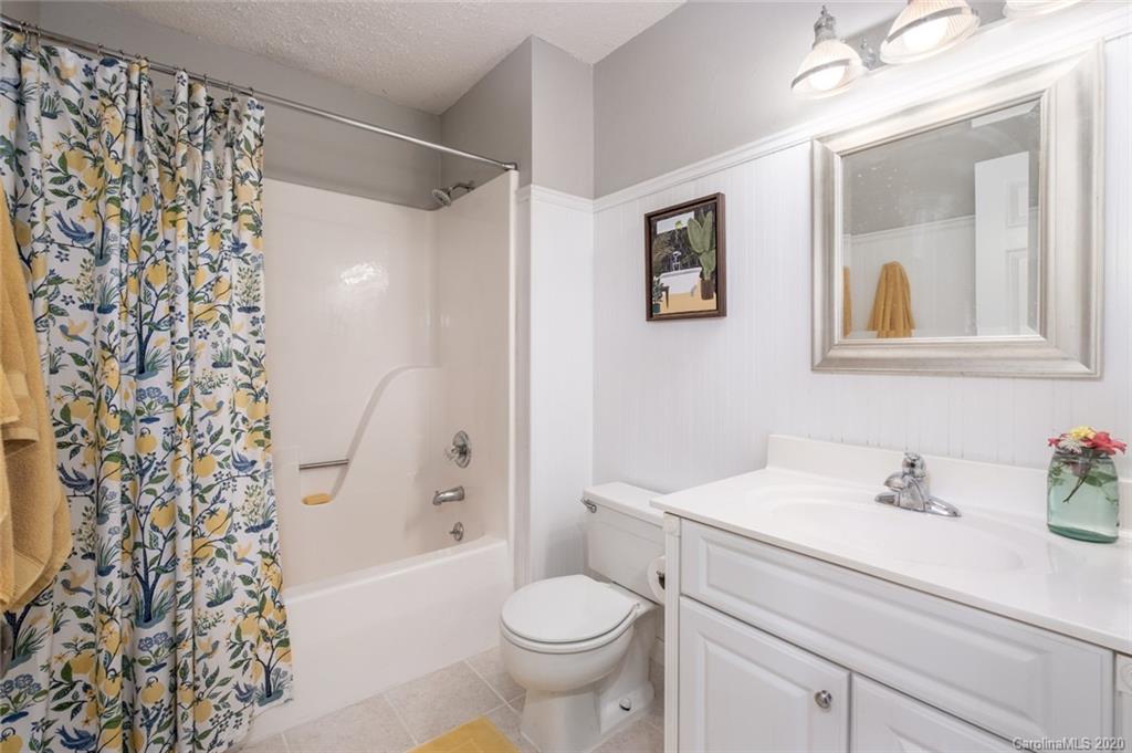 1130 Churchill Road Davidson, NC 28036 - Photo 23 of 38 a bathroom with a sink toilet and shower