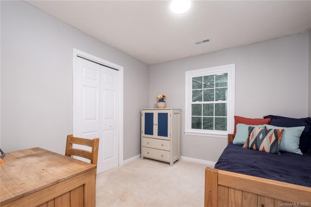 1130 Churchill Road Davidson, NC 28036 - Photo 24 of 38 a living room with furniture and a window