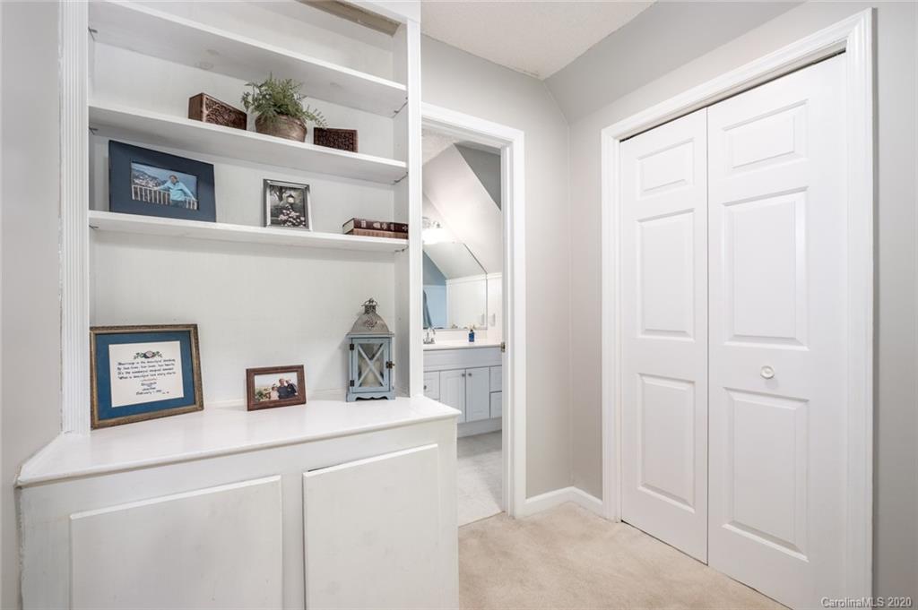 1130 Churchill Road Davidson, NC 28036 - Photo 29 of 38 a bathroom with a sink and a mirror