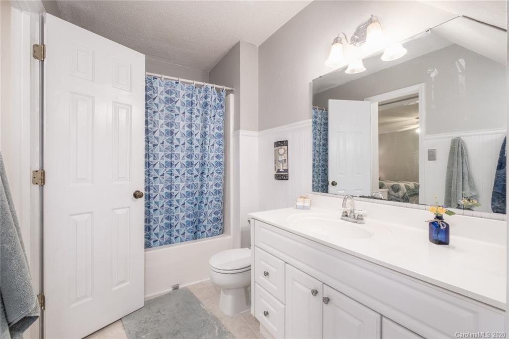 1130 Churchill Road Davidson, NC 28036 - Photo 30 of 38 a bathroom with a sink a toilet and shower