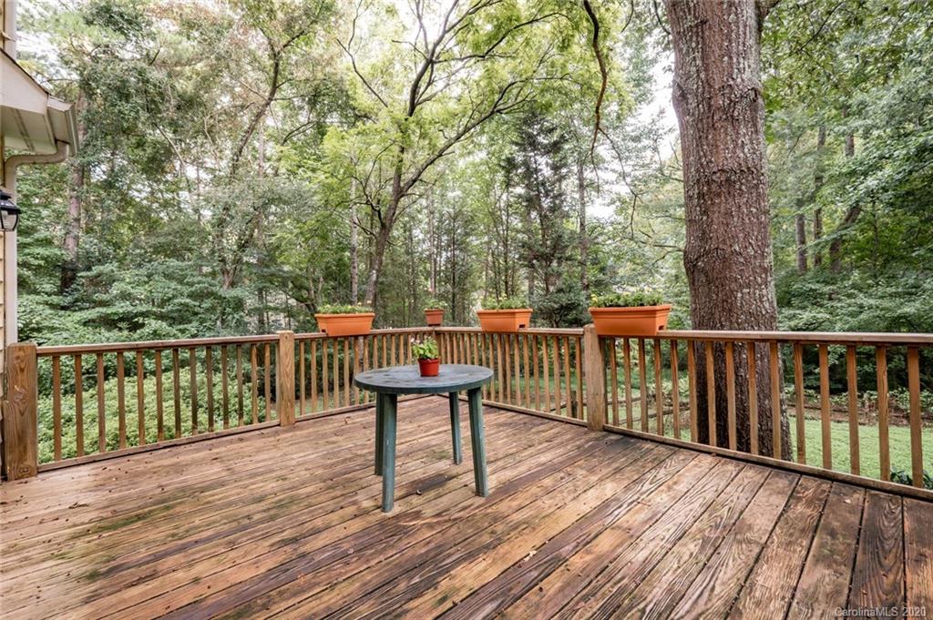 1130 Churchill Road Davidson, NC 28036 - Photo 32 of 38 a view of a deck with two chairs and wooden floor