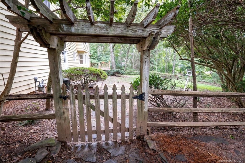 1130 Churchill Road Davidson, NC 28036 - Photo 33 of 38 a view of a porch with furniture and wooden deck