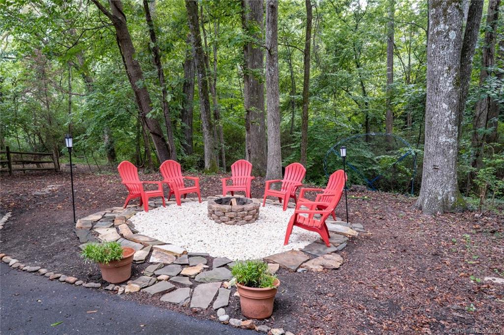 1130 Churchill Road Davidson, NC 28036 - Photo 34 of 38 a view of a patio with chairs and table potted plants