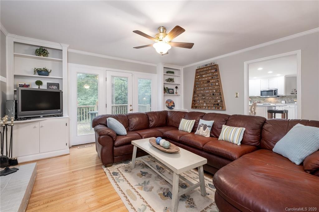 1130 Churchill Road Davidson, NC 28036 - Photo 5 of 38 a living room with furniture flat screen tv and windows