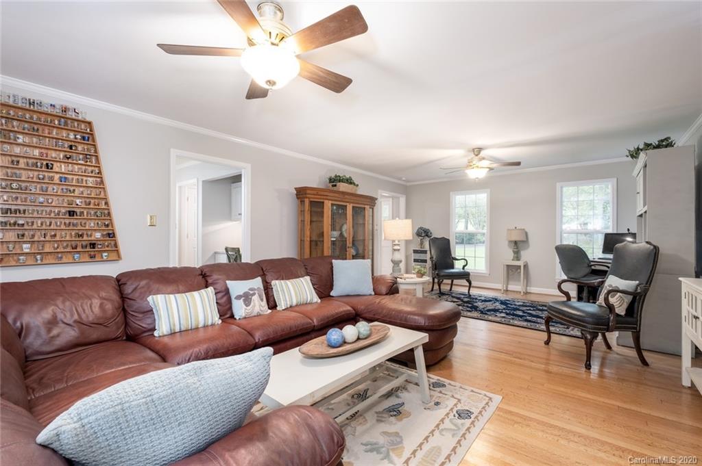 1130 Churchill Road Davidson, NC 28036 - Photo 6 of 38 a living room with furniture and wooden floor