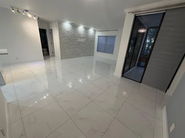 a view of a livingroom with an empty space and a workspace