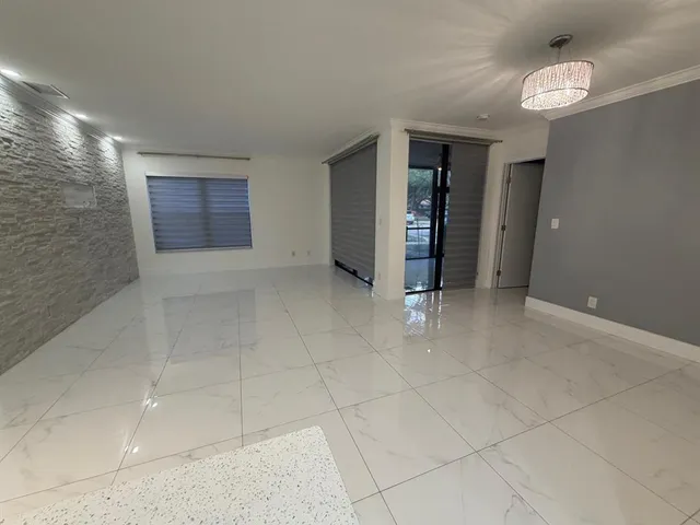 a living room with lots of furniture and appliances