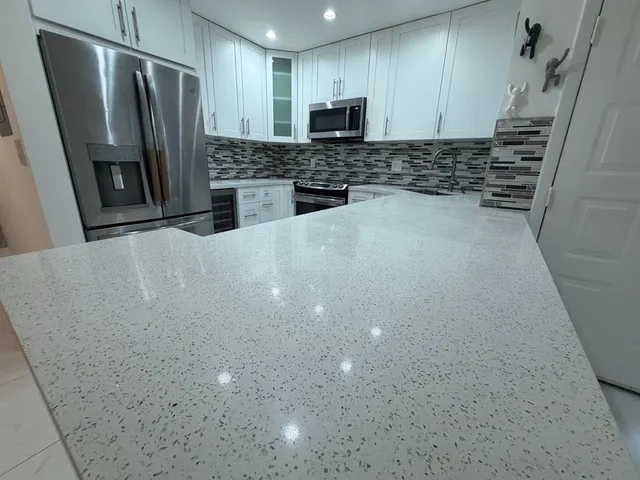 a bedroom with a bed and a potted plant