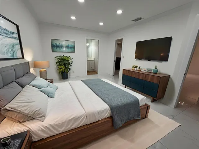 a white toilet sitting next to a bath tub and shower