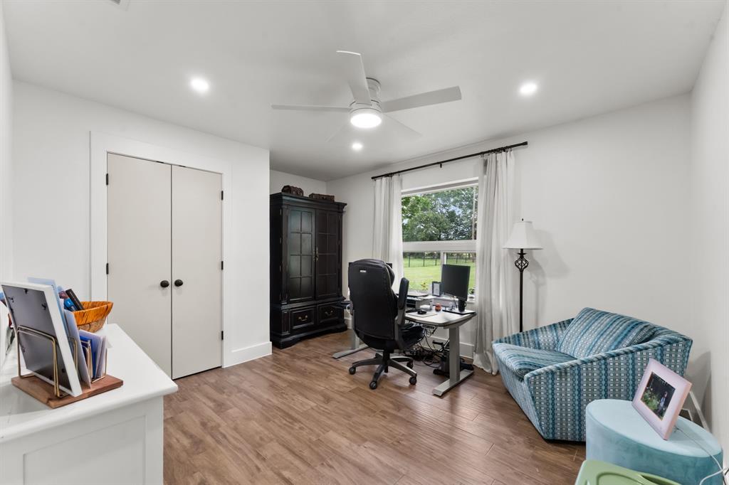380 Farr Altom Road Seagoville, TX 75159 - Photo 13 of 30 Room featuring wood-finish flooring and a ceiling fan with integrated lighting