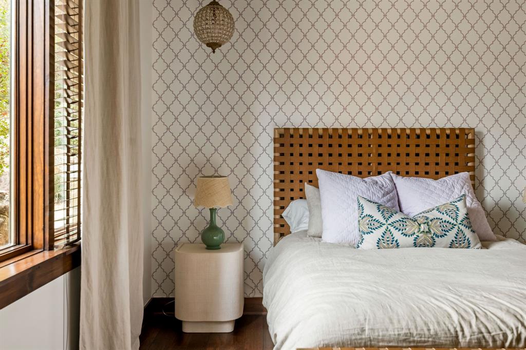 9930 Boat Club Road Fort Worth, TX 76179 - Photo 23 of 40 This downstairs guest bedroom allows its own sense of charm with its unique wall prints and space.