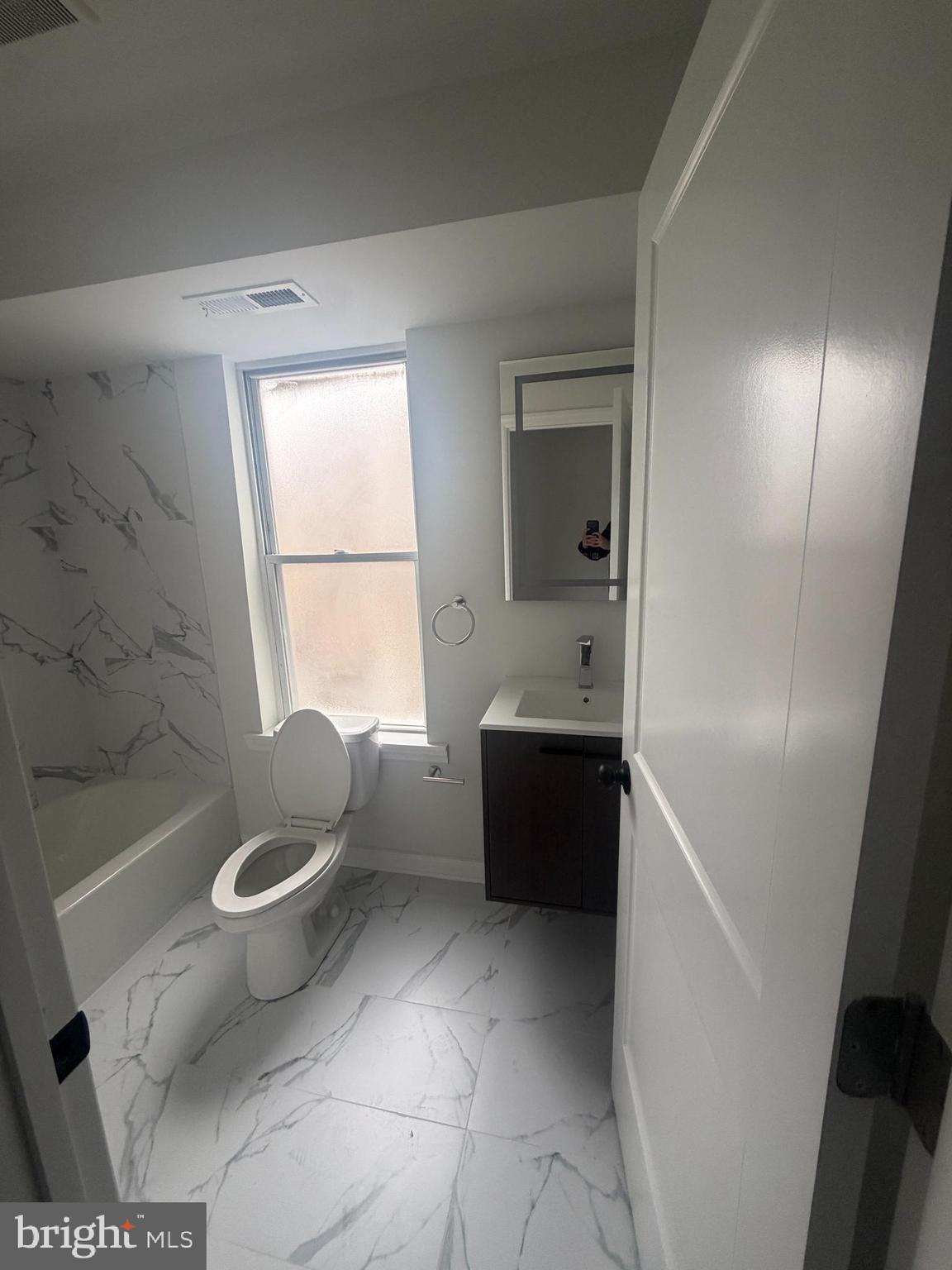 112 East Huntingdon Street, Unit 2 Philadelphia, PA 19125 - Photo 9 of 12 a bathroom with a tub toilet and sink