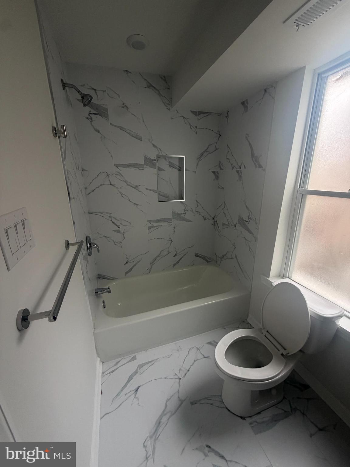 112 East Huntingdon Street, Unit 2 Philadelphia, PA 19125 - Photo 10 of 12 a bathroom with a toilet a sink and a bathtub