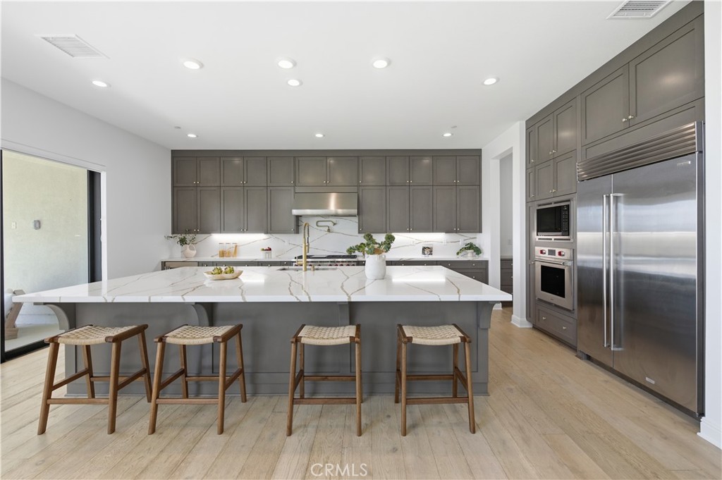 20164 Galway Lane Porter Ranch, CA 91326 - Photo 10 of 48 Professional-grade kitchen with curated high-end finishes