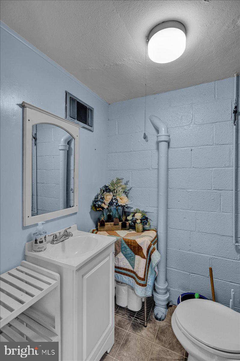 59 Upland Road Reading, PA 19609 - Photo 19 of 30 Half bath off of garage