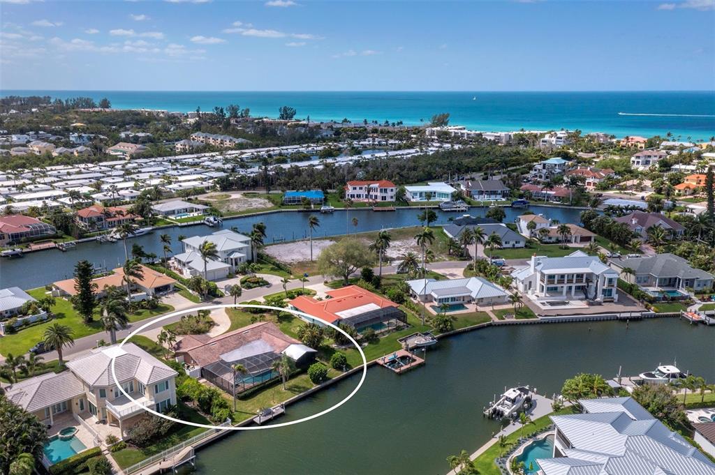 741 Old Compass Road Longboat Key, FL 34228 - Photo 44 of 57 an aerial view of a house with a lake view
