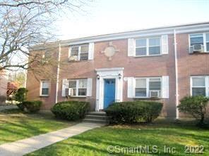 211 Seaton Road, Unit 2 Stamford, CT 06902 - Photo 1 of 1 a view of a brick building next to a yard with big trees